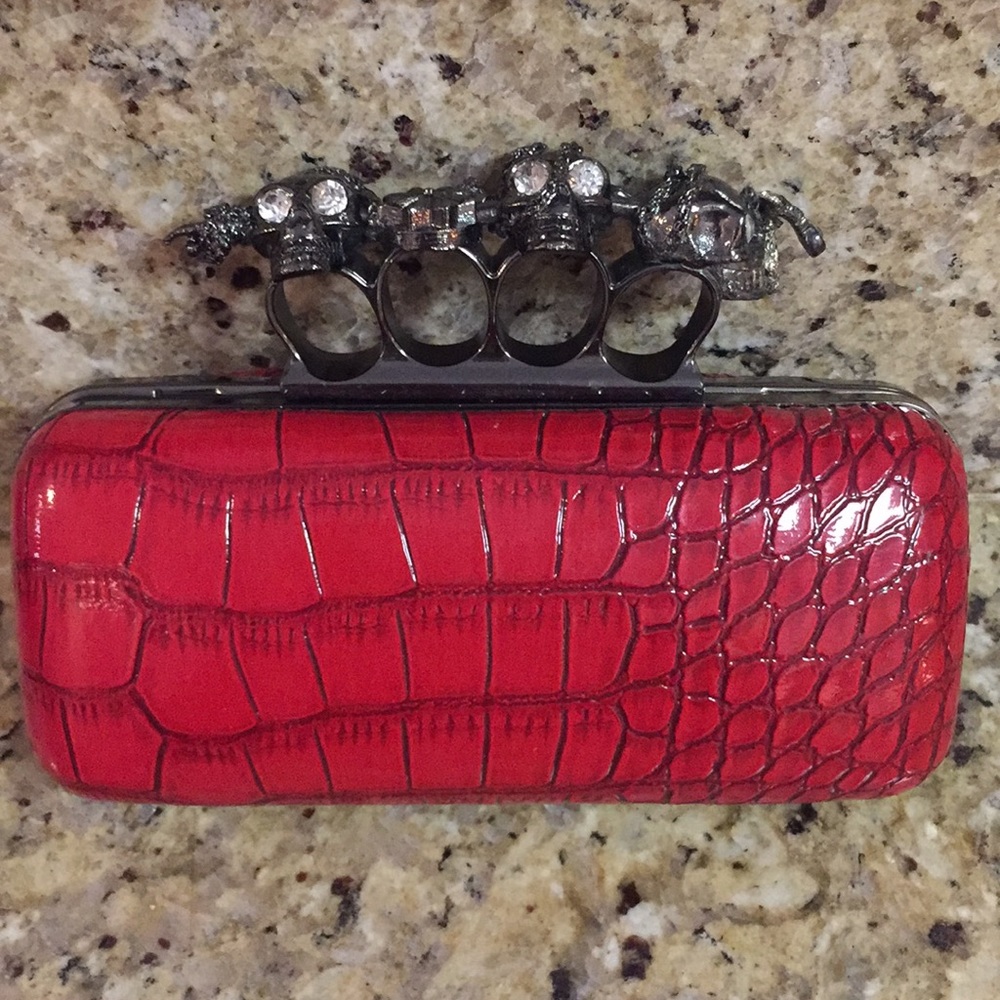 Red patent leather skull brass knuckles clutch